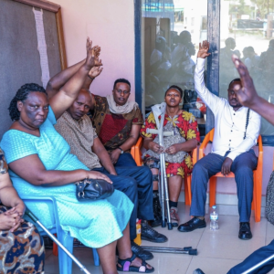 Voters from people with disabilities before casting their votes at the polling site to vote a member of parliament to represent persons with disabilities in the Chamber of Deputies, in Nyarugenge District